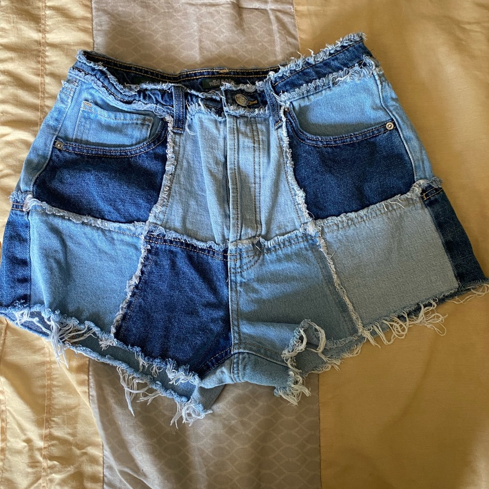 Lightly used multi colored denim shorts.